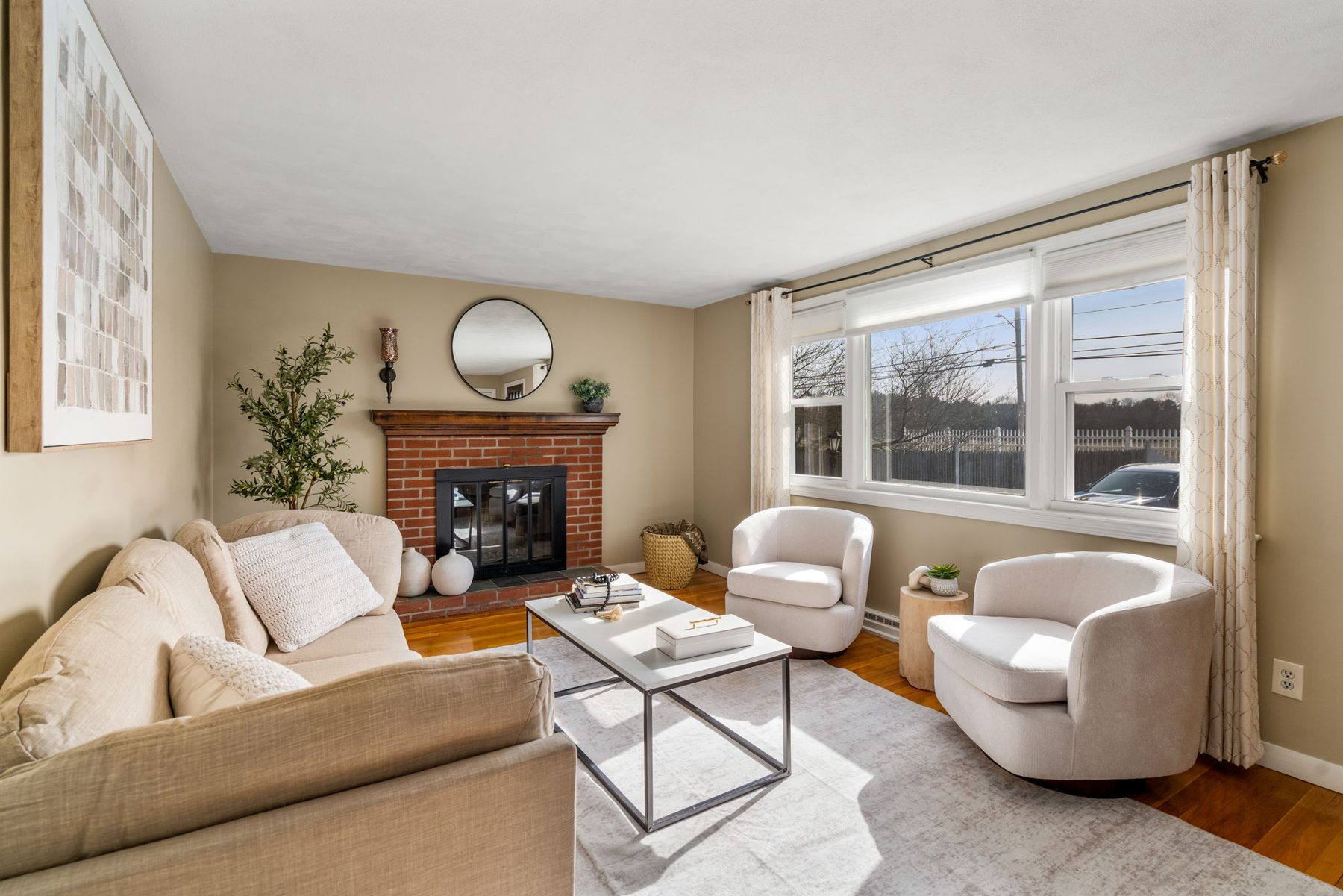 Staged living room at 483 South Main St, Sharon, MA