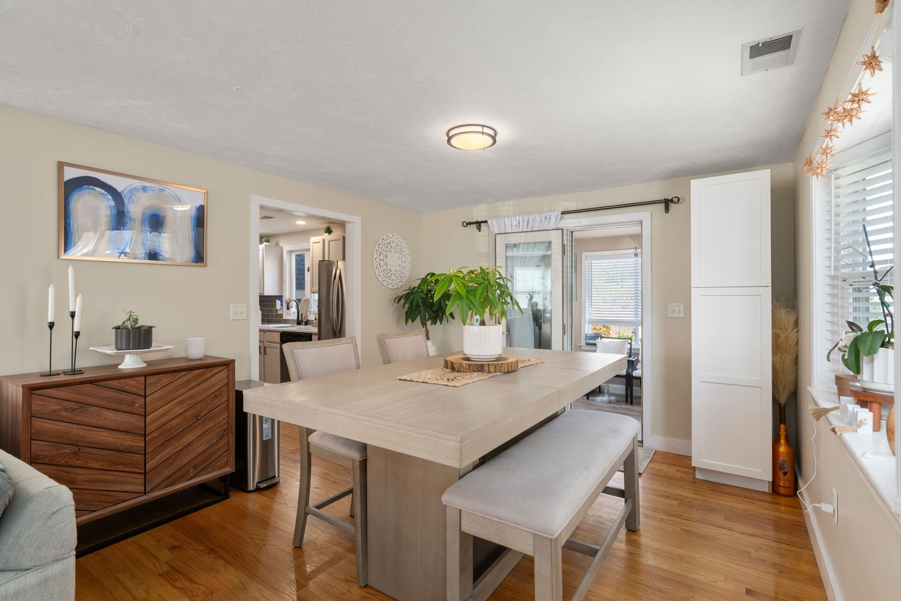 Staged dining room at 142 Norwell St, Dorchester, MA