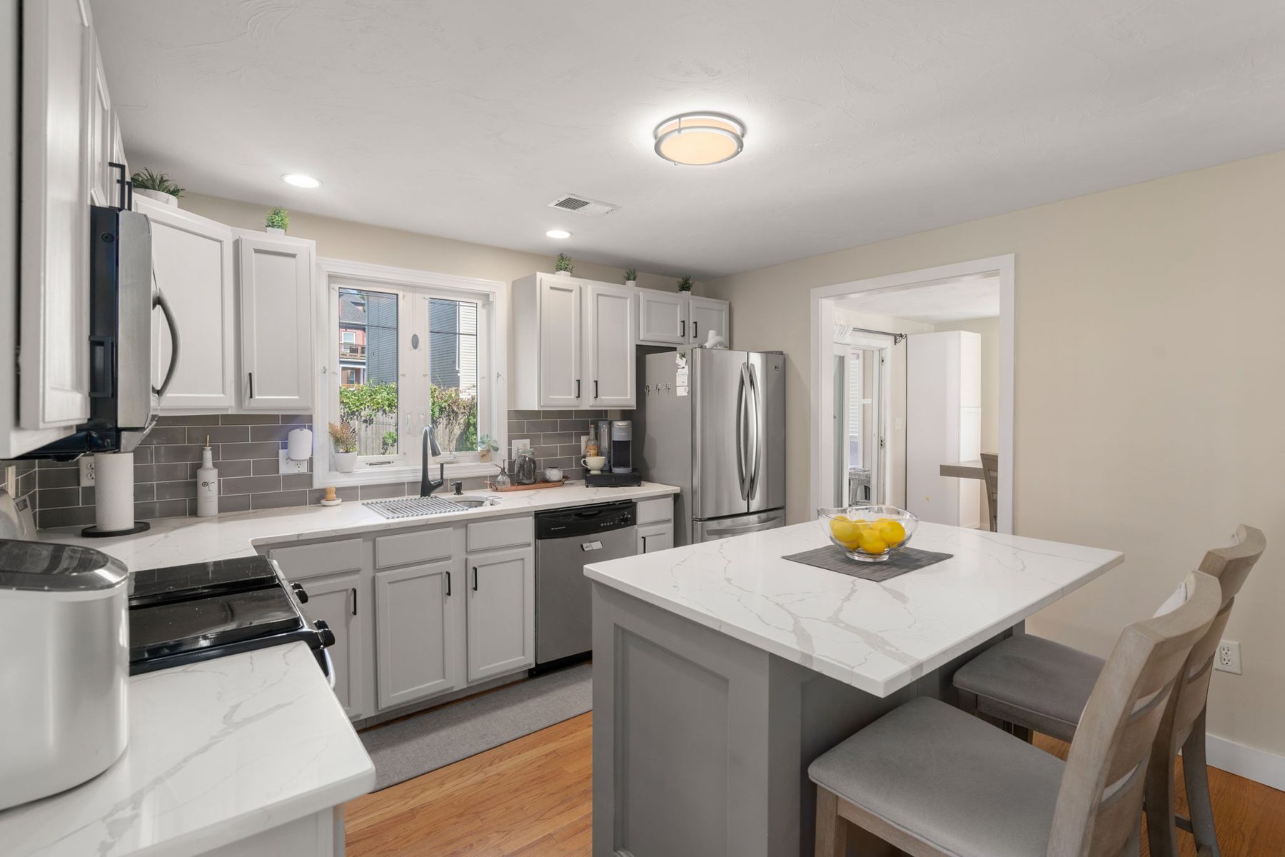 Staged kitchen at 142 Norwell St, Dorchester, MA
