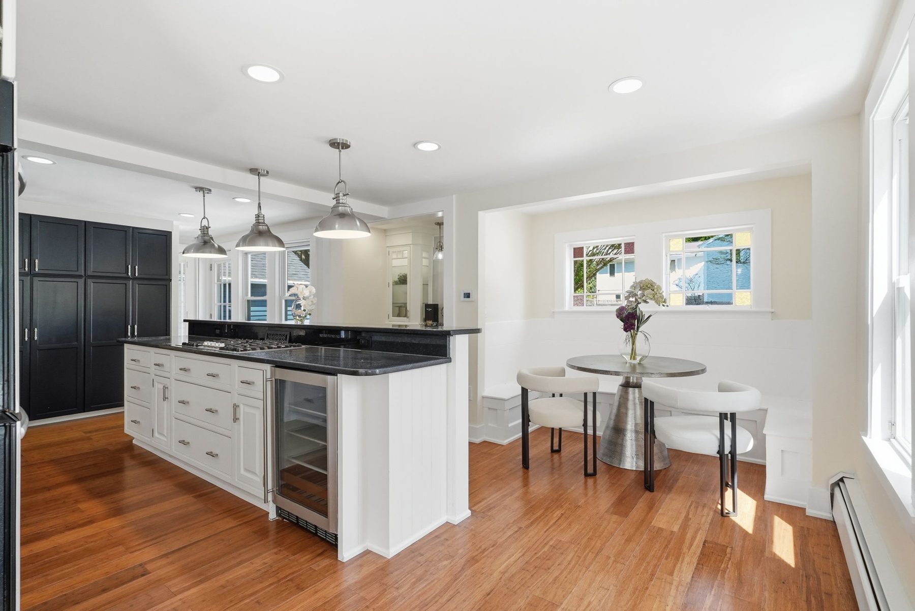 8 Pemberton Road, Wayland — Updated kitchen: stainless appliances, black pantry wall, island with wine fridge, breakfast nook