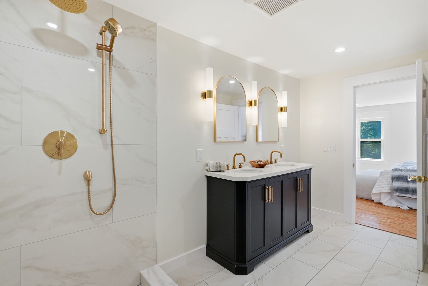 8 Pemberton Road, Wayland — Primary bath: black vanity, brass, marble walk-in shower