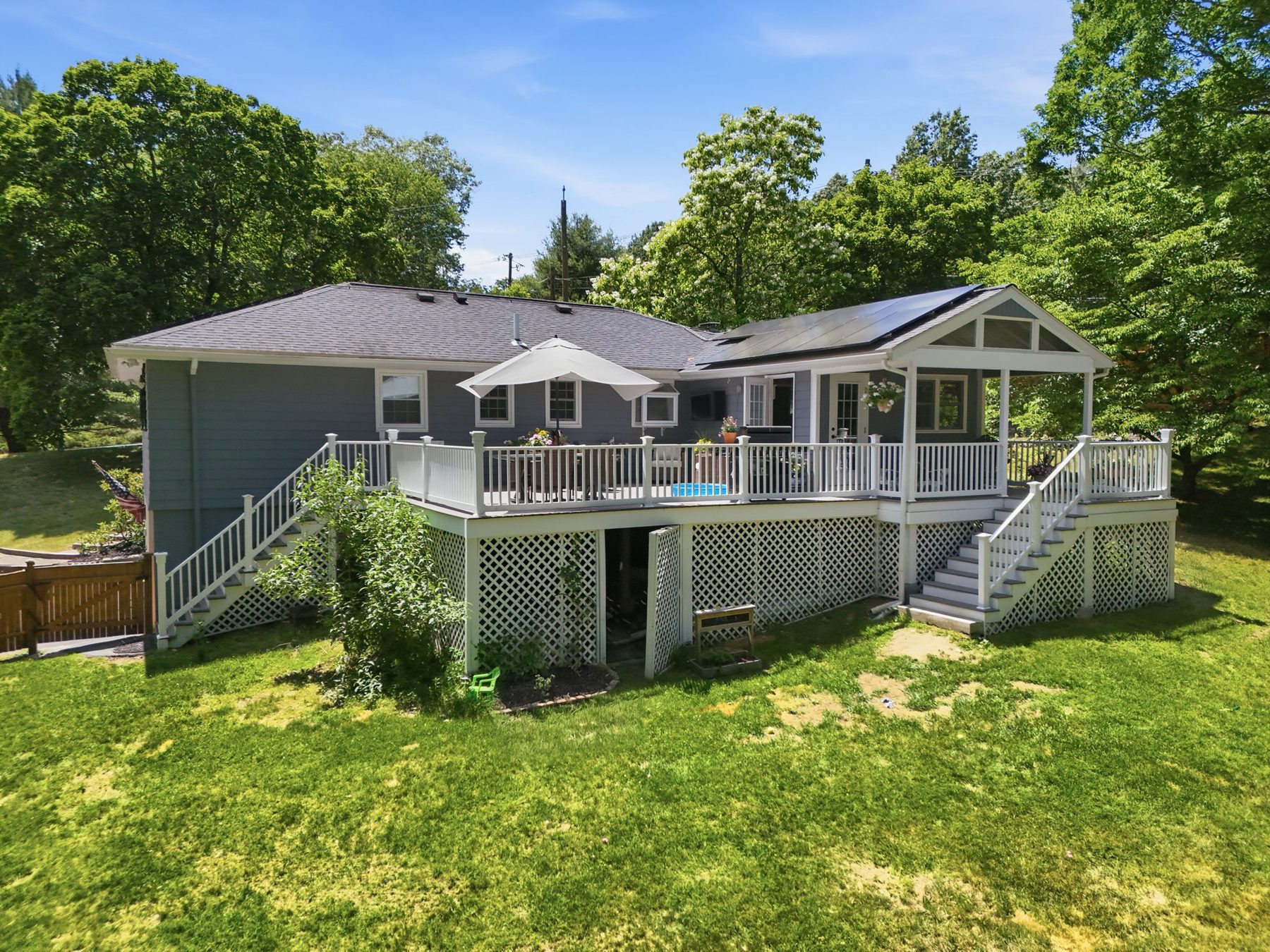 5 Stanford Drive, Westwood — Composite deck, covered porch, and solar