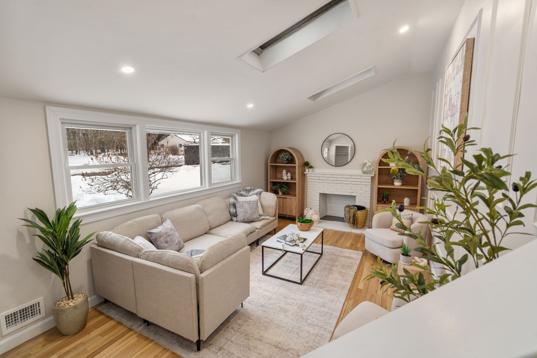 Staged vaulted living room at 11 Wilshire Dr, Sharon, MA